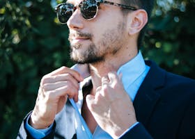 Man in Blue Dress Shirt and Black Formal Suit